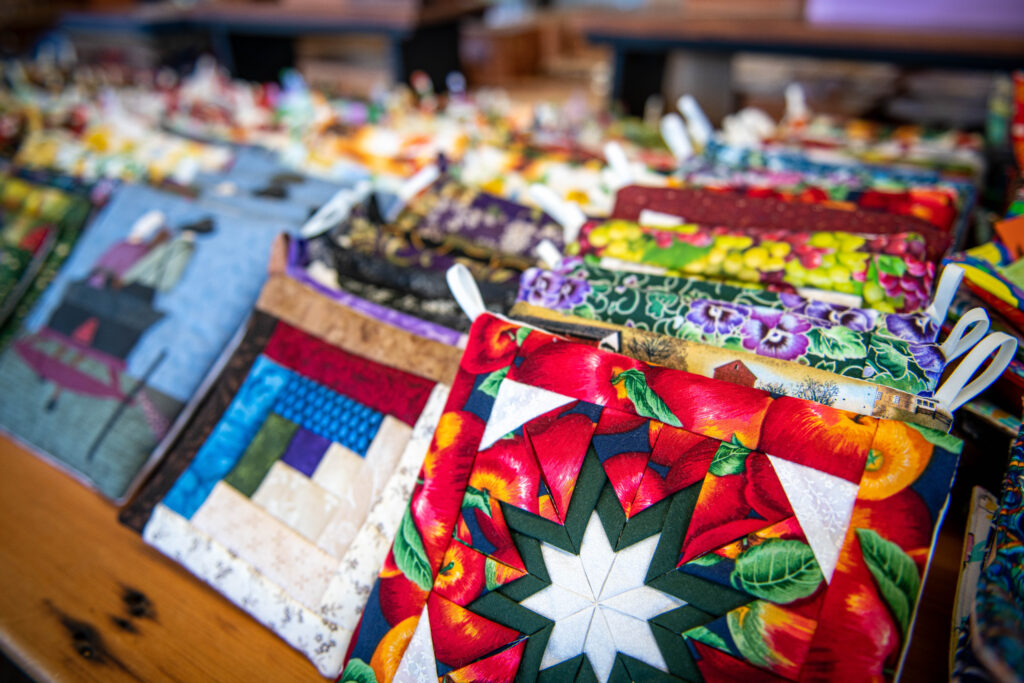 Large selection of hand quilted hot pads and spice mats