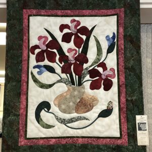 Whimsical Iris applique Wall Hanging that is hand quilted