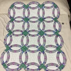 Handmade Amish Double Wedding Ring quilt throw in sage green and lavender floral fabric