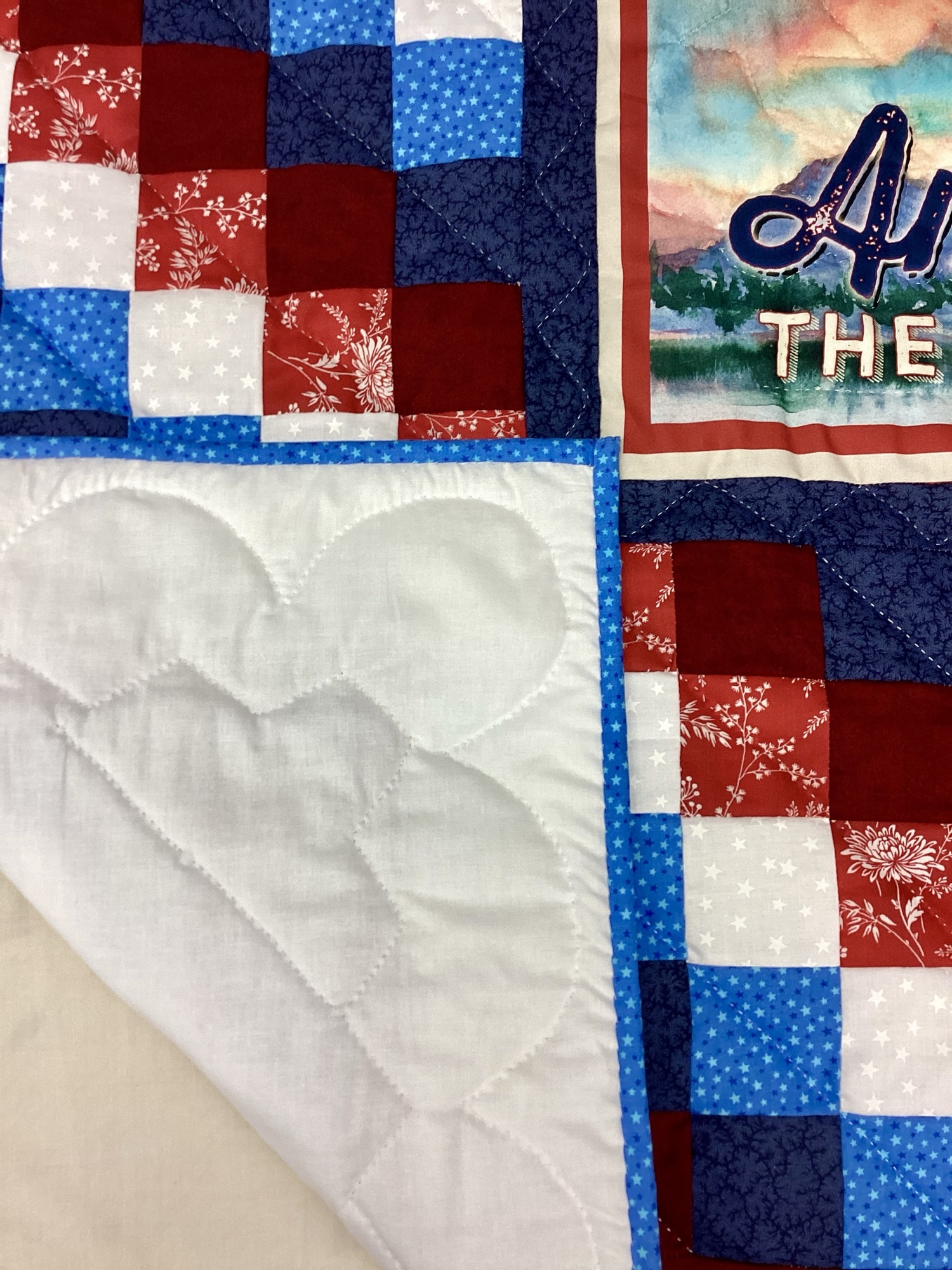 Backing of Handmade Amish patriotic quilt throw with eagle and American flag panel
