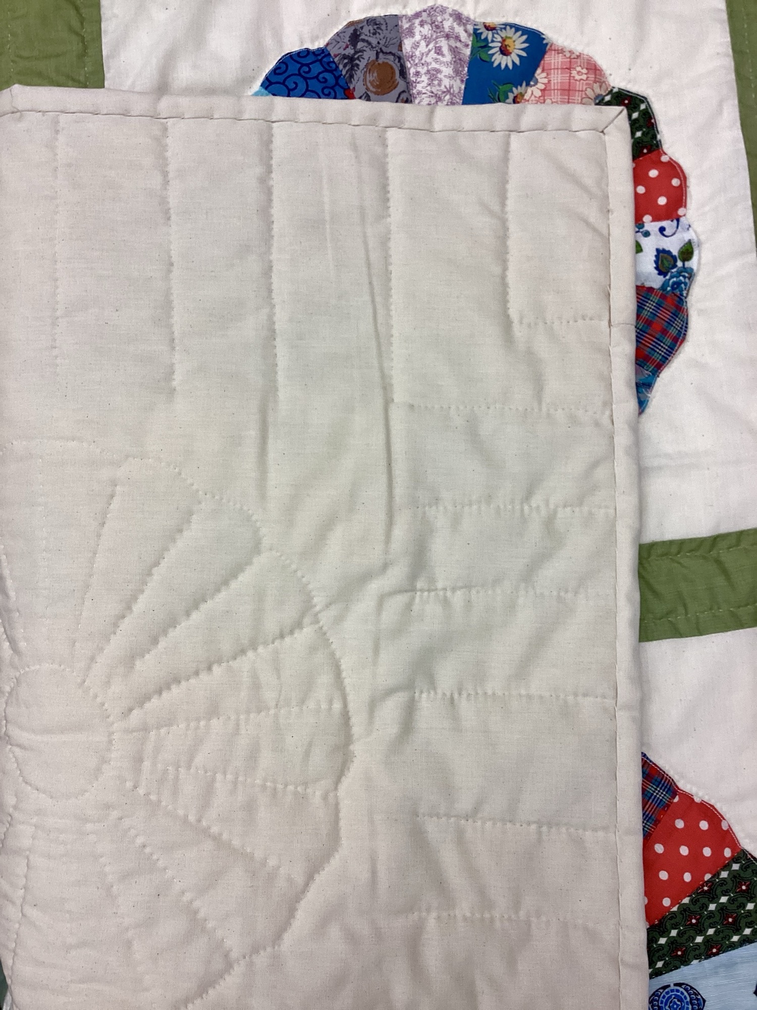 Back of Handmade Lancaster County vintage Dresden Plate quilt with authentic 1940s fabrics and hand quilting in Twin throw size