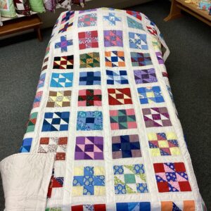 Handmade Lancaster County vintage sampler quilt using authentic 1940s fabrics with hand quilting in Twin or Throw size