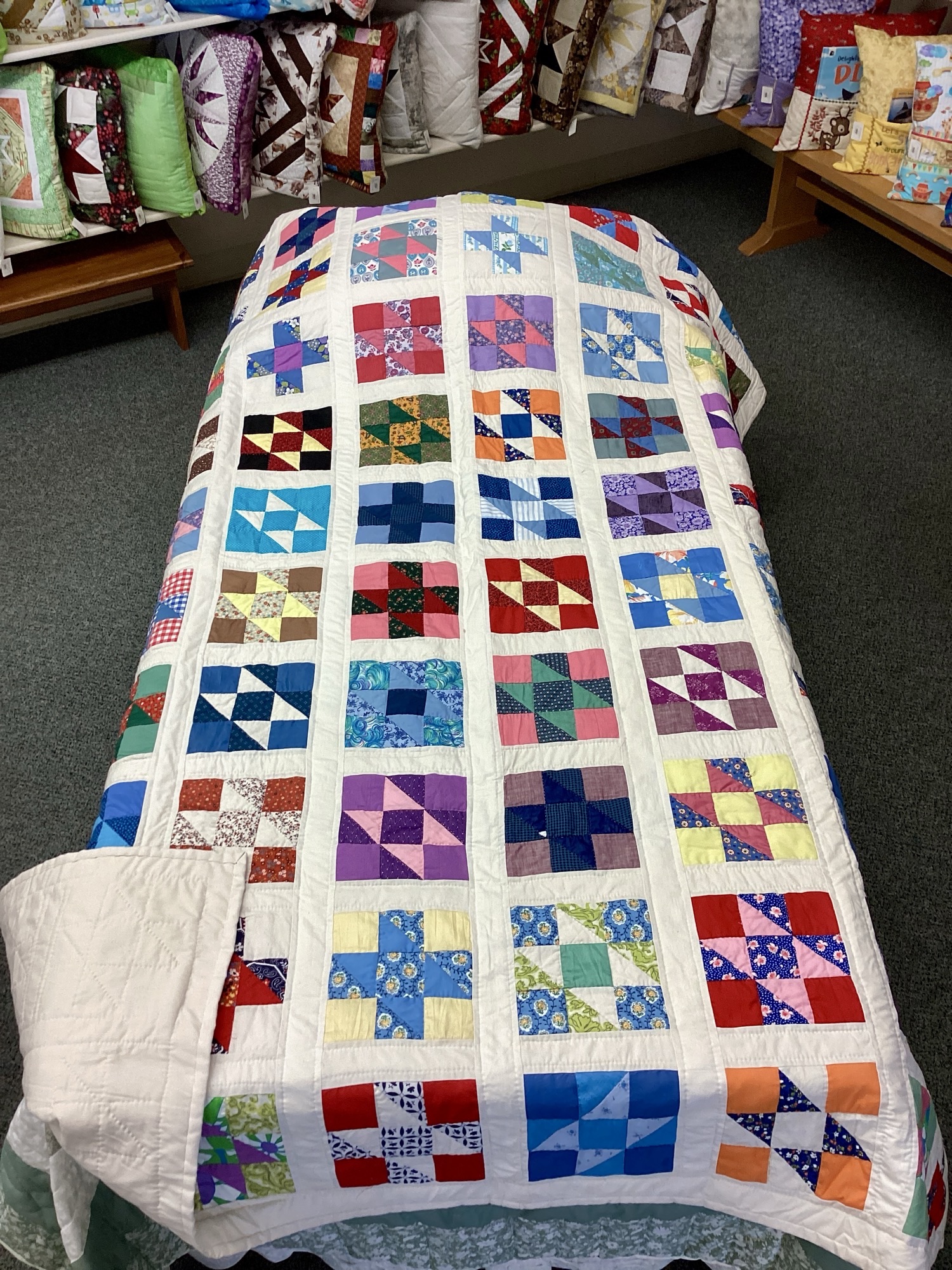 Handmade Lancaster County vintage sampler quilt using authentic 1940s fabrics with hand quilting in Twin or Throw size