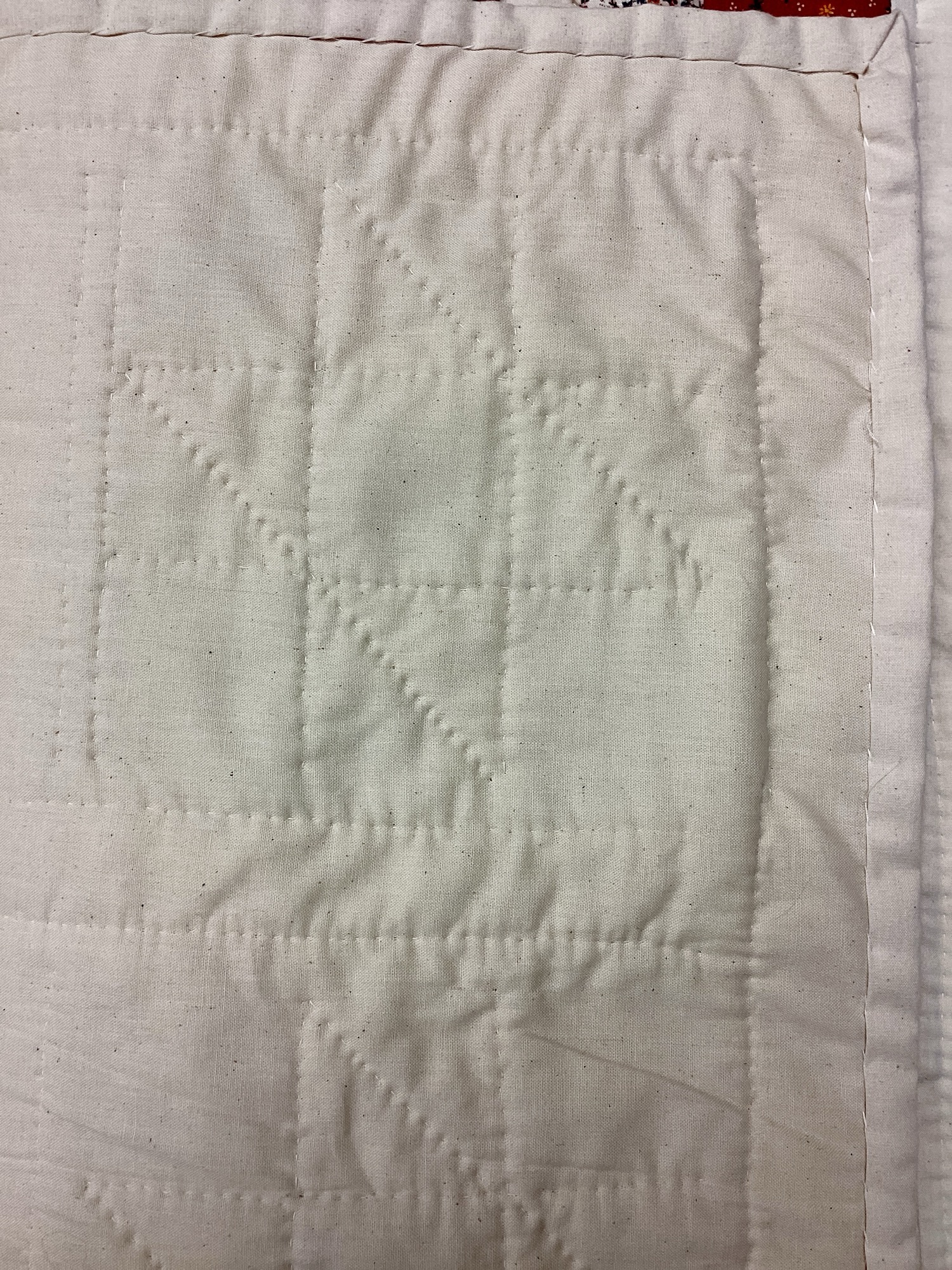 Back of vintage sampler in twin size