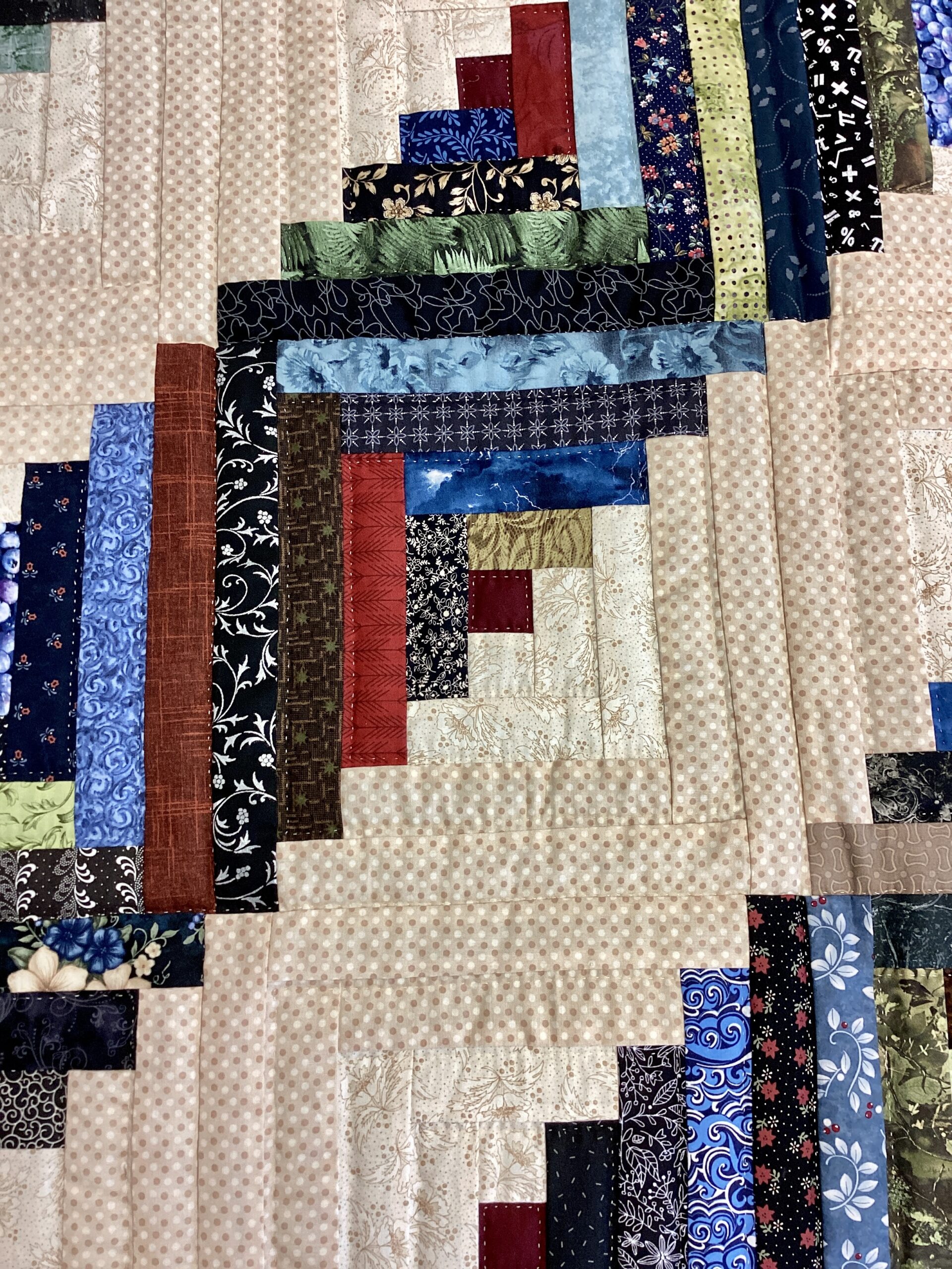 Navy and burgundy border with hand stitching on Lancaster County Amish Log Cabin quilt