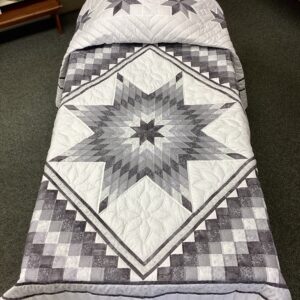 Handmade Lancaster County Mennonite Star N Common quilt with gray and silver center star, pieced Boston Common border, floral hand quilting, and scalloped edges